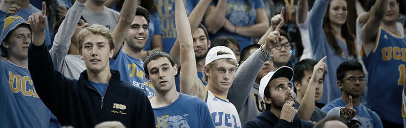 People cheering at a March Madness game